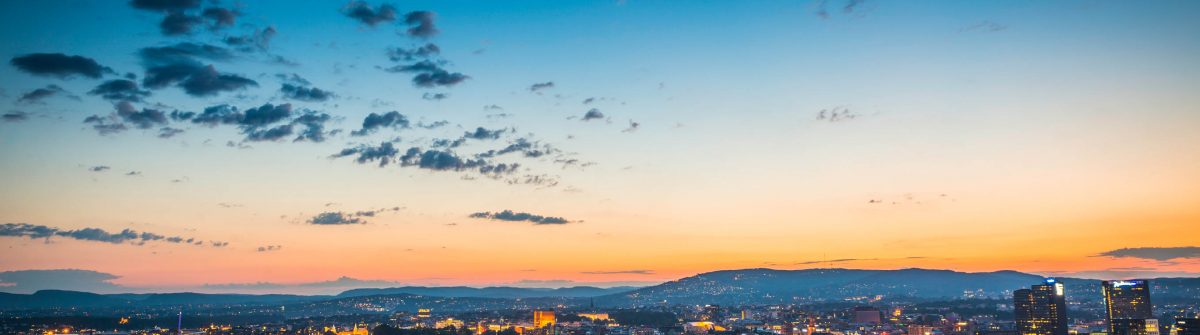 Oslo city lights illuminated under blue chrome dusk sky Norway iStock_000055261494_Large-2