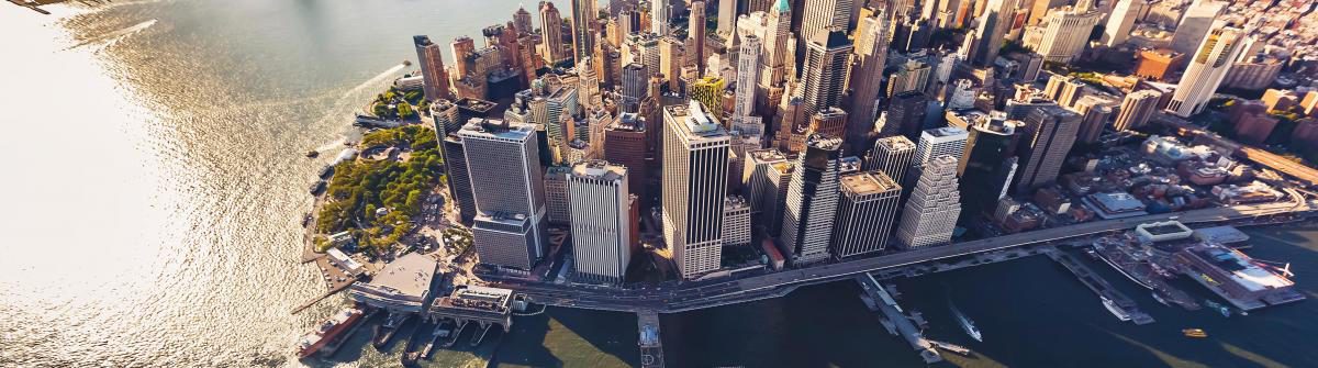 aerial-view-of-lower-manhattan-new-york-city-istock_103394967_xlarge-1-1200×335