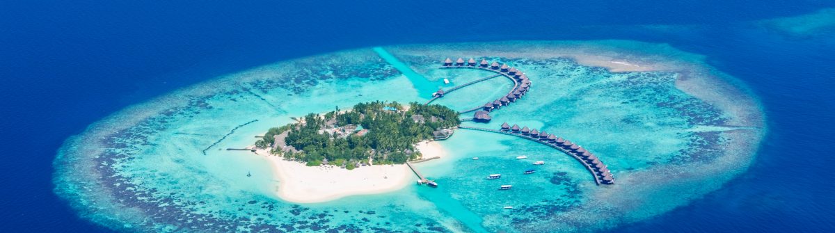 Sea plane flying above Maldives islands shutterstock_389529229-2