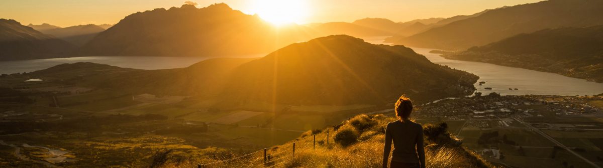 Woman silhouette at sunset on the mountain