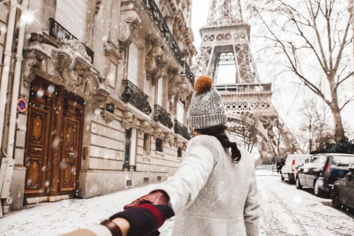 paris_woman_eiffel_winter_iStock-929982144-1-1